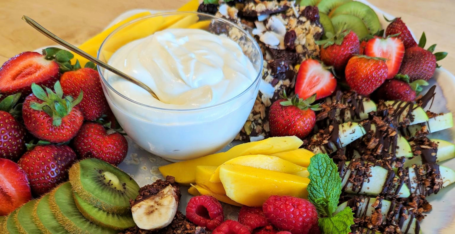 A colorful, flavorful fruit platter using a variety of fresh fruit, Struesli granola and chocolate.