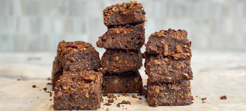 A flavorful stack of rich sweet potato brownies with Struesli granola.