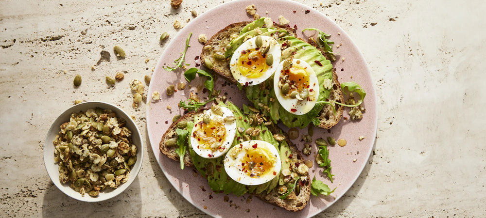 Elevated avocado toasts with rich jammy eggs and nutrient-rich Struesli granola.