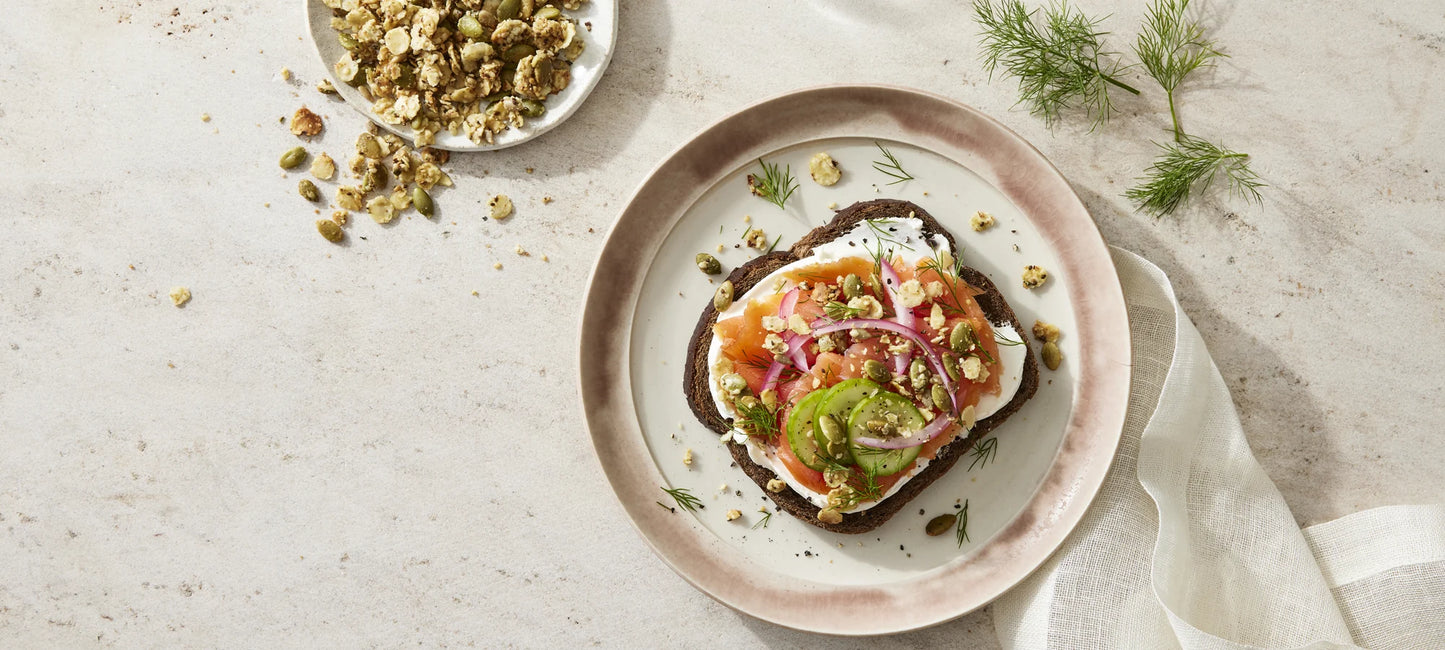 A single slice of toasted rye topped with smoked salmon and Struesli's organic granola for satisfying crunch.