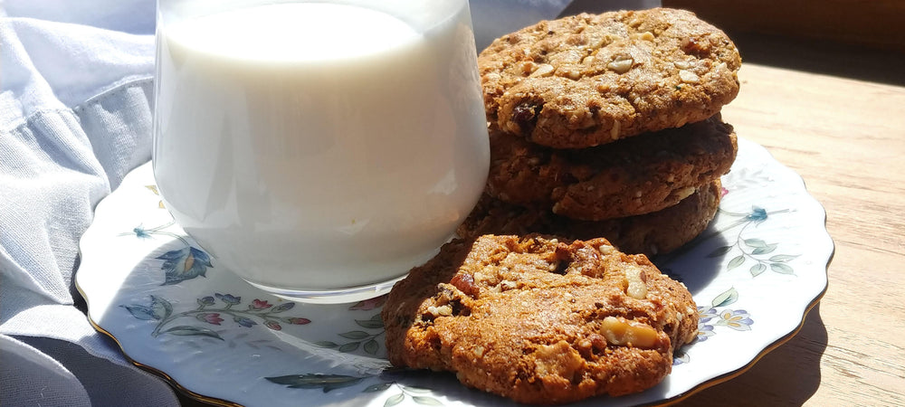Crunchy cookies paired with milk, using raisins and struesli granola.