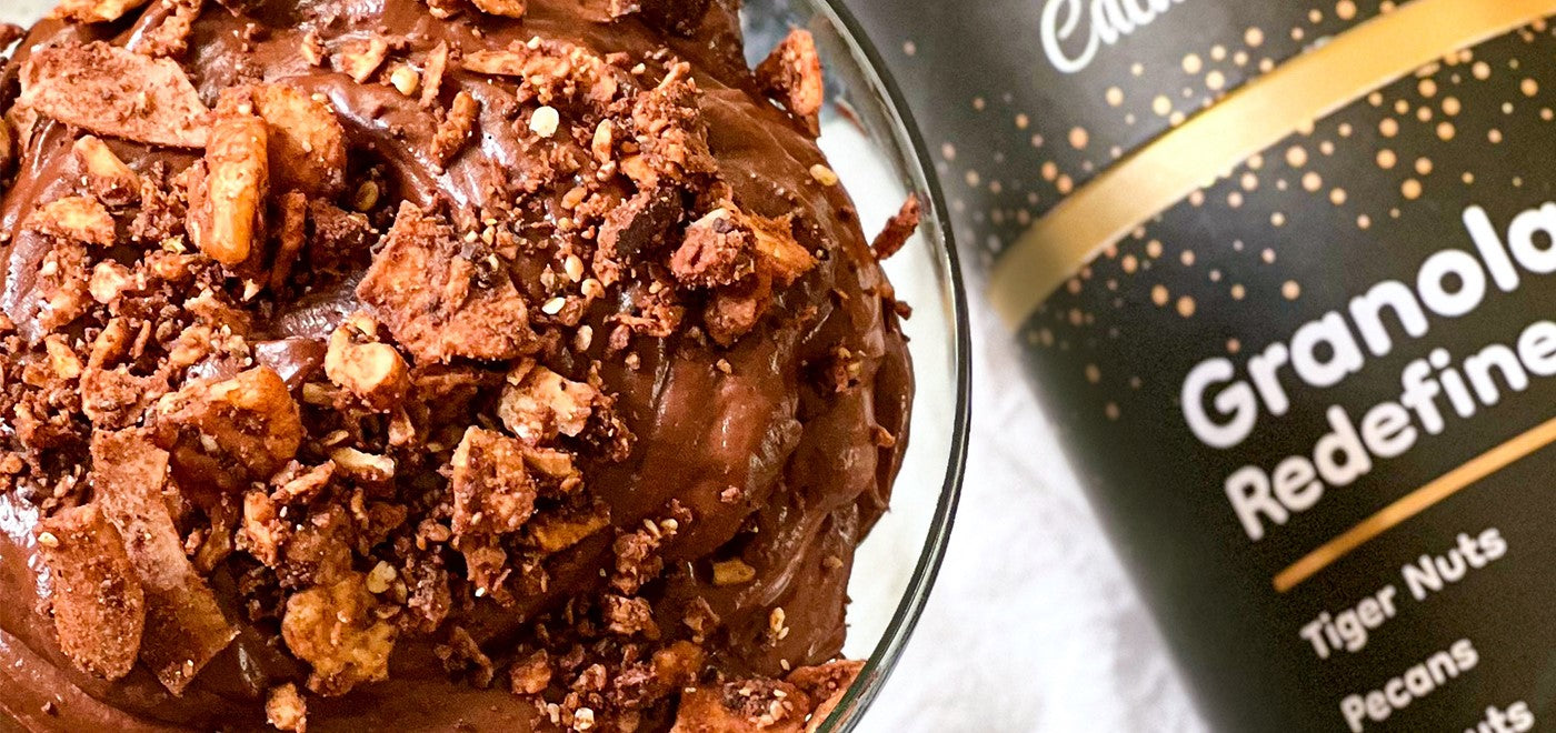 Vegan chocolate mousse using rich avocado, topped with Struesli's organic cacao + coffee granola.