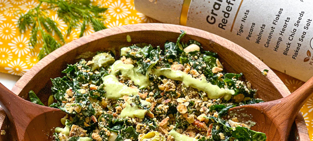 A flavorful bowl of kale salad using Struesli granola for satisfying crunch.