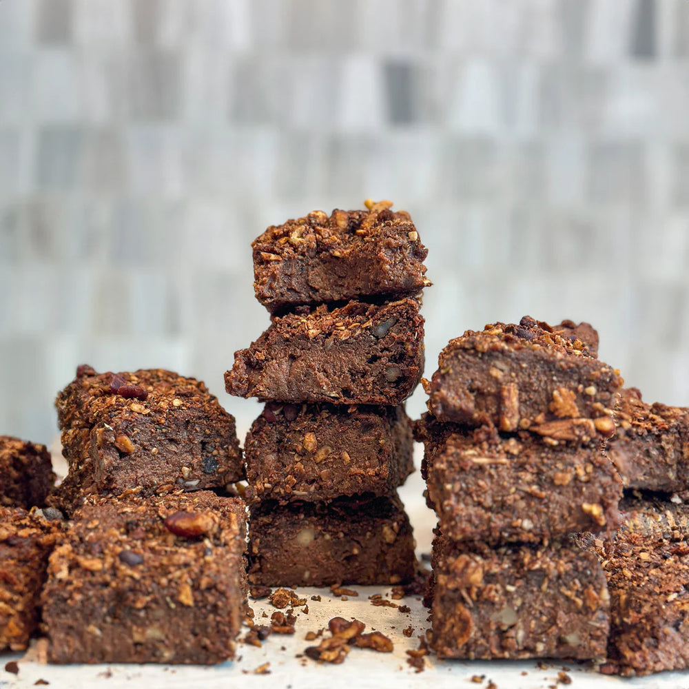 A stack of rich sweet potato brownies made with Struesli's organic Cacao + coffee granola.
