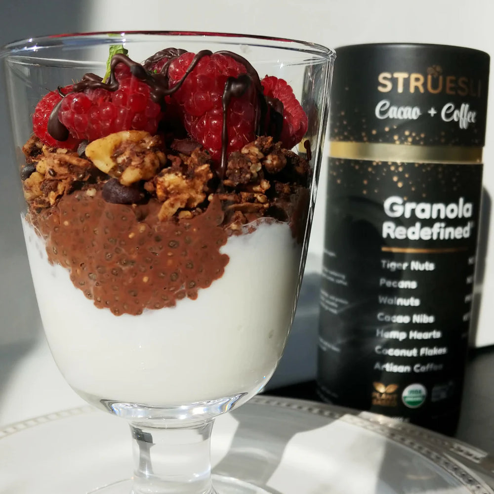 Layered chocolate chia pudding topped with fruit and Struesli's cacao + coffee granola.