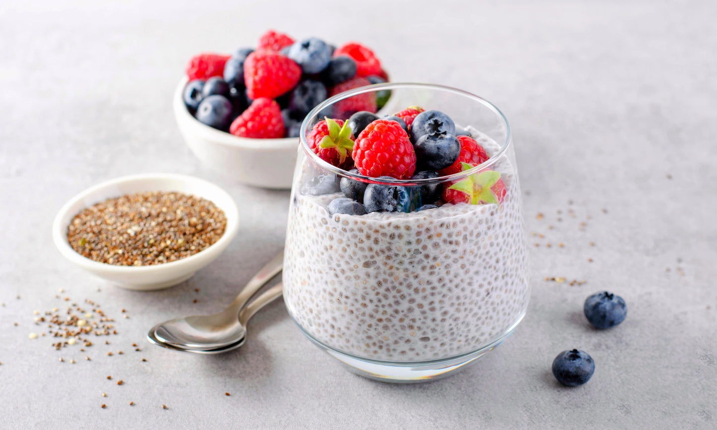 Chia Pudding With Fruit Next to a Bowl of Chia Seeds