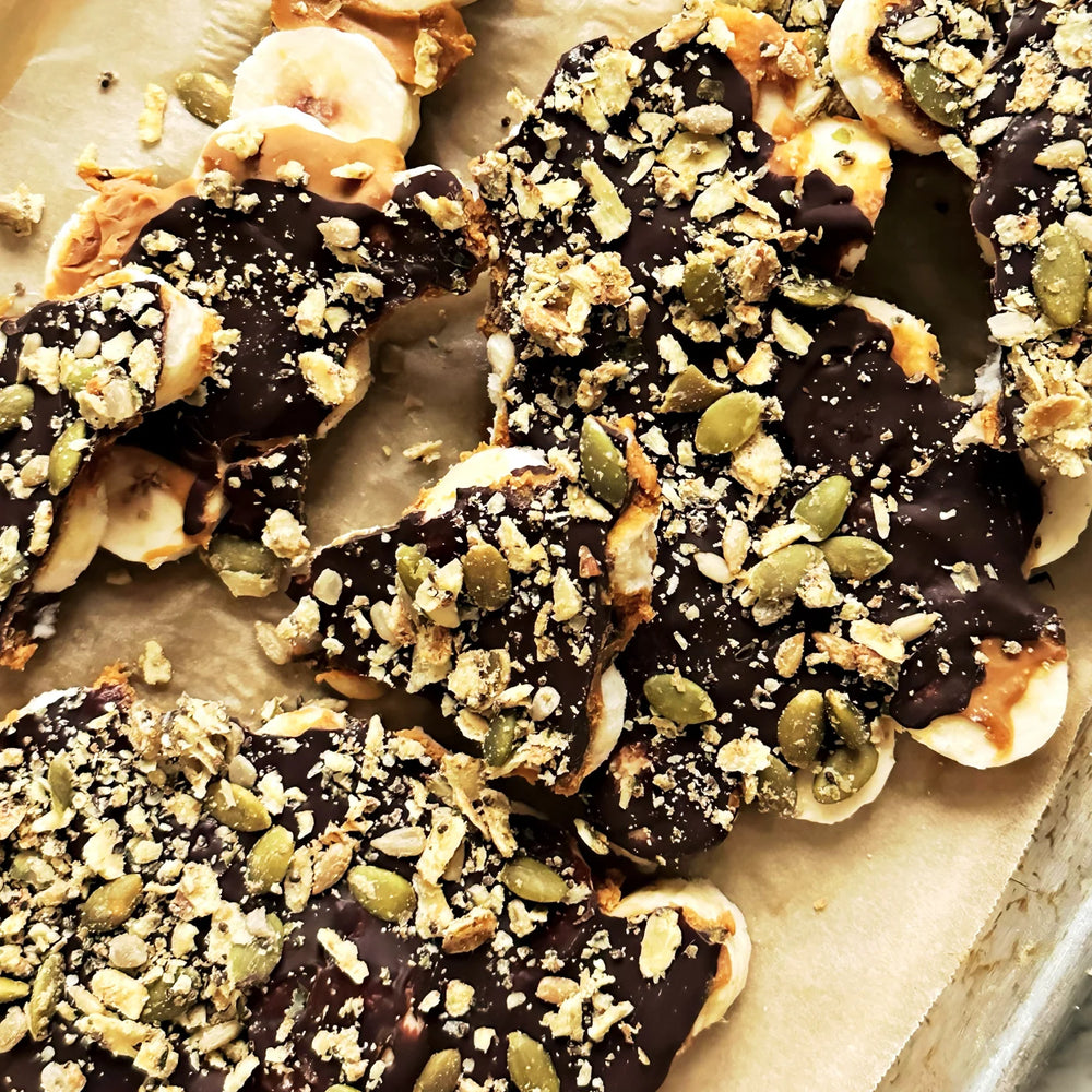 Frozen banana bark with chocolate, peanut butter and Struesli Savory + Seed sprinkled on top.