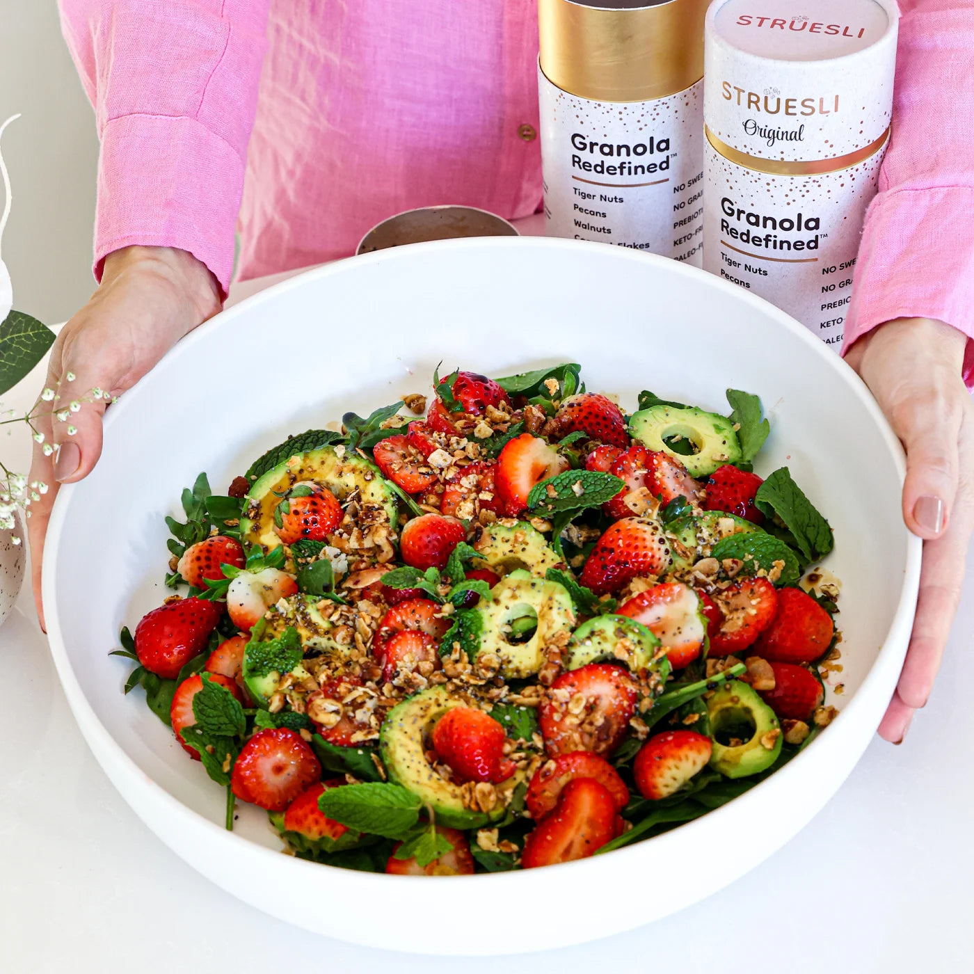 vegan strawberry and avocado salad with granola crunch.