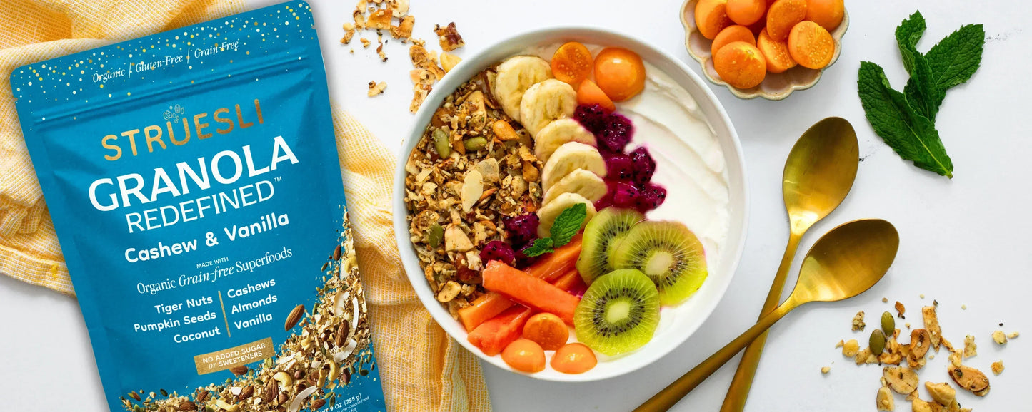 A yogurt bowl topped with Struesli Cashew & Vanilla organic granola and fruit.