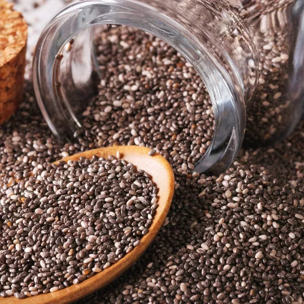 Chia seeds spilling out of a bottle