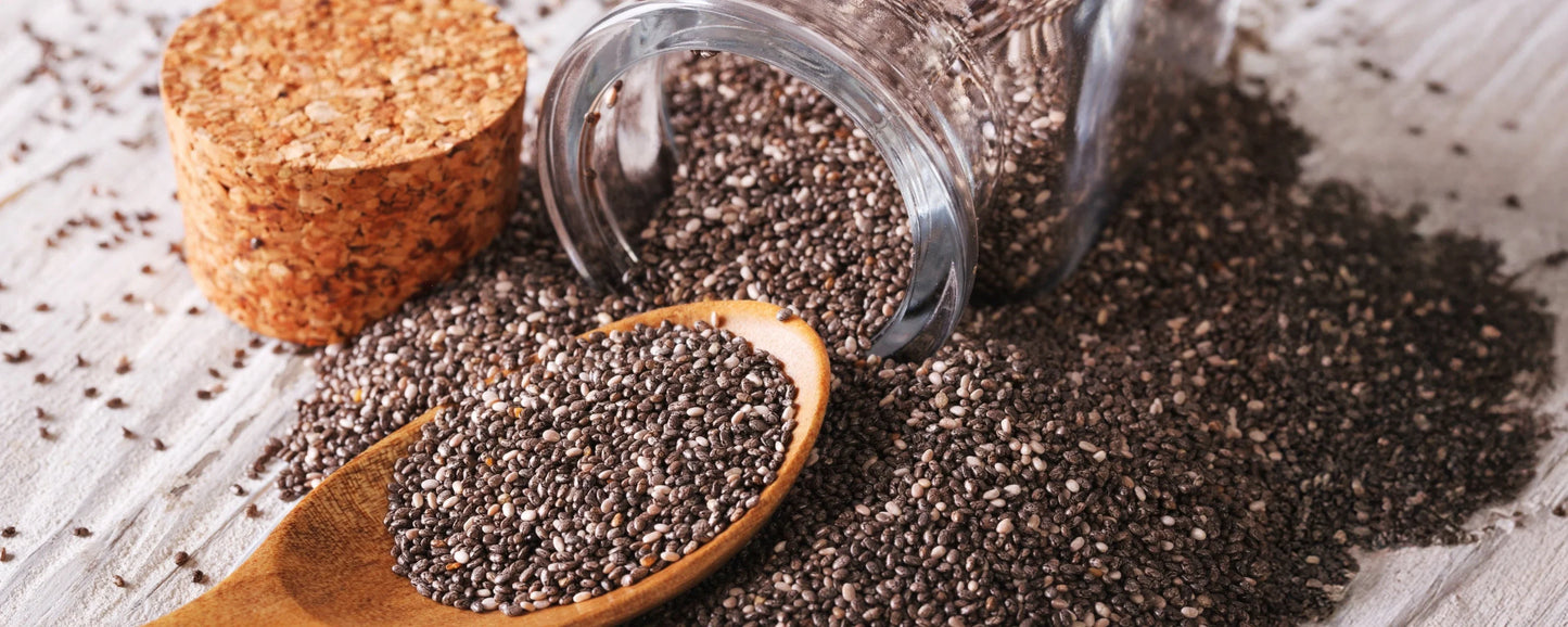 Chia seeds spilling out of a bottle