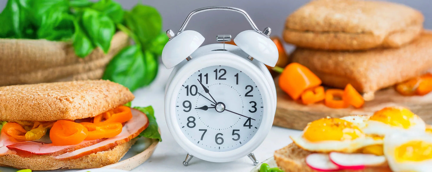 A clock on a breakfast table