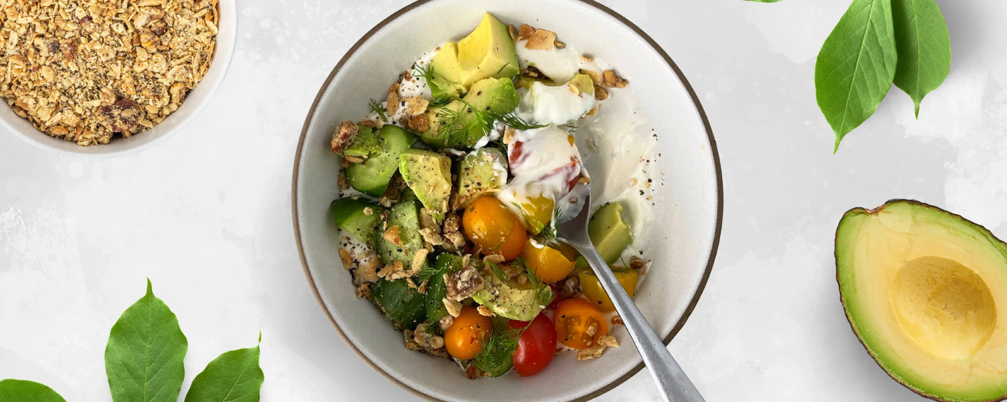 A savory yogurt bowl topped with Struesli's grain-free granola and veggies