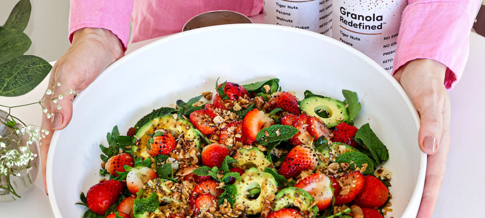 Simple strawberry and avocado salad with granola crunch.