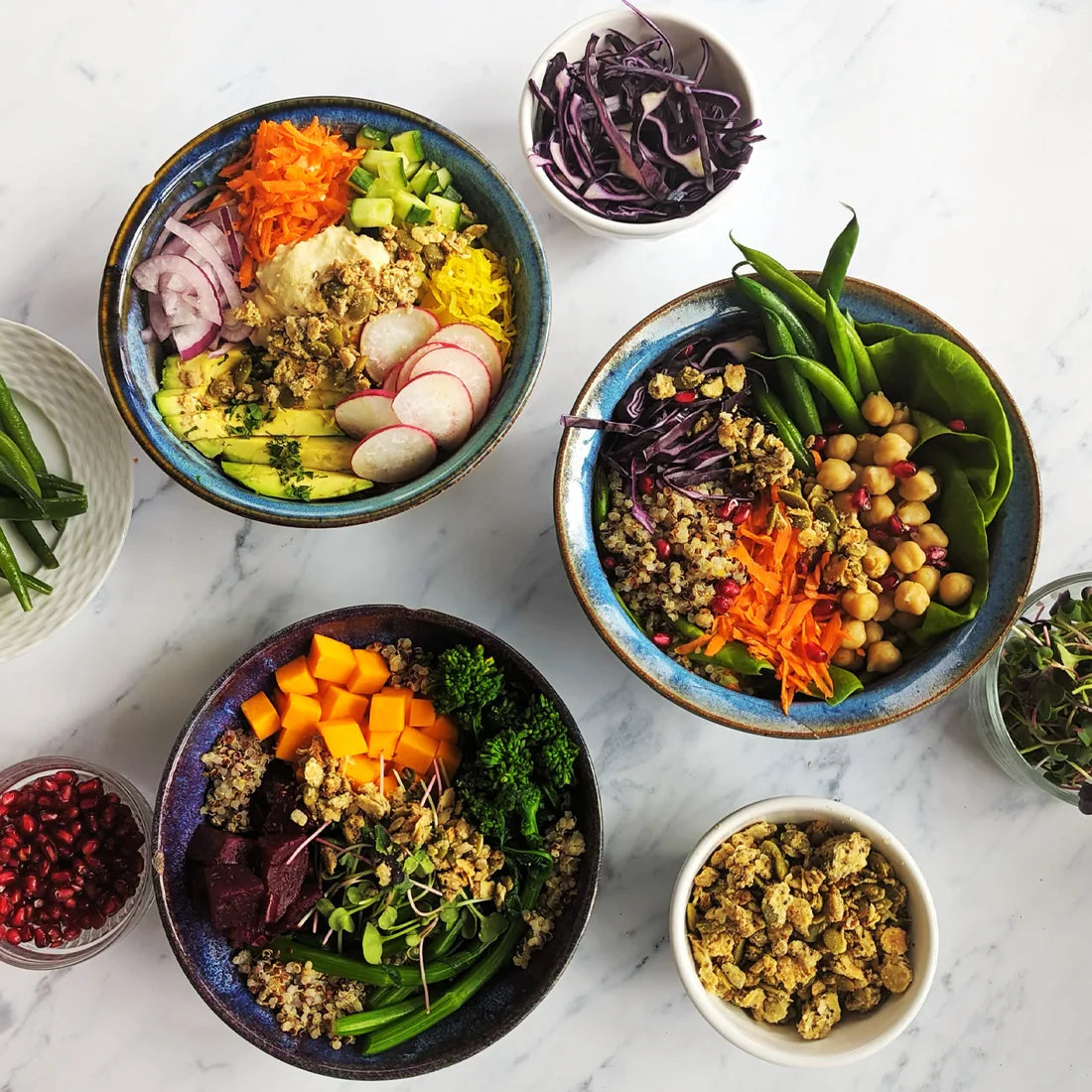 Plant-based rainbow nourish bowl with colorful veggies and savory granola