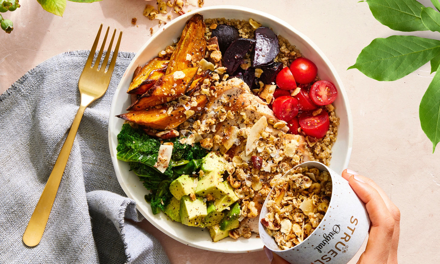 Struesli Original Granola sprinkled over a nourishing lunch bowl.