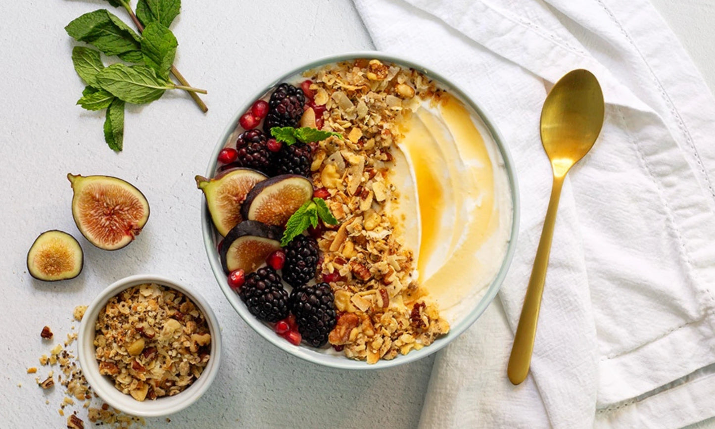 A yogurt bowl topped with Struesli Original granola and figs