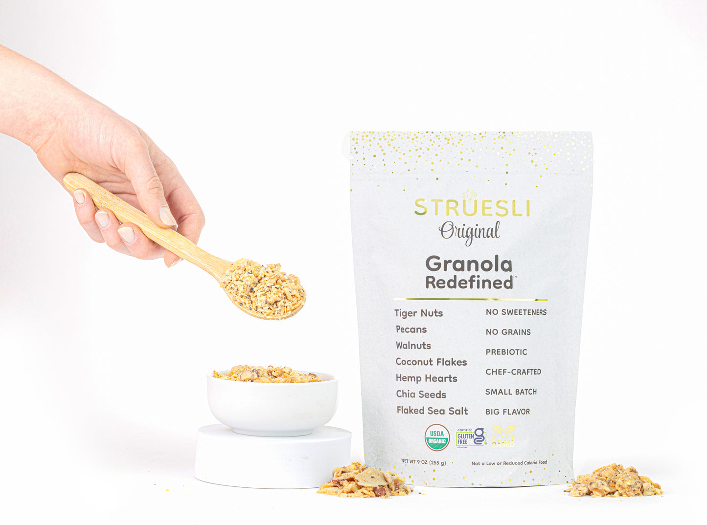 
                  
                    A package of Struesli Original granola next to a bowl and spoonful of granola
                  
                
