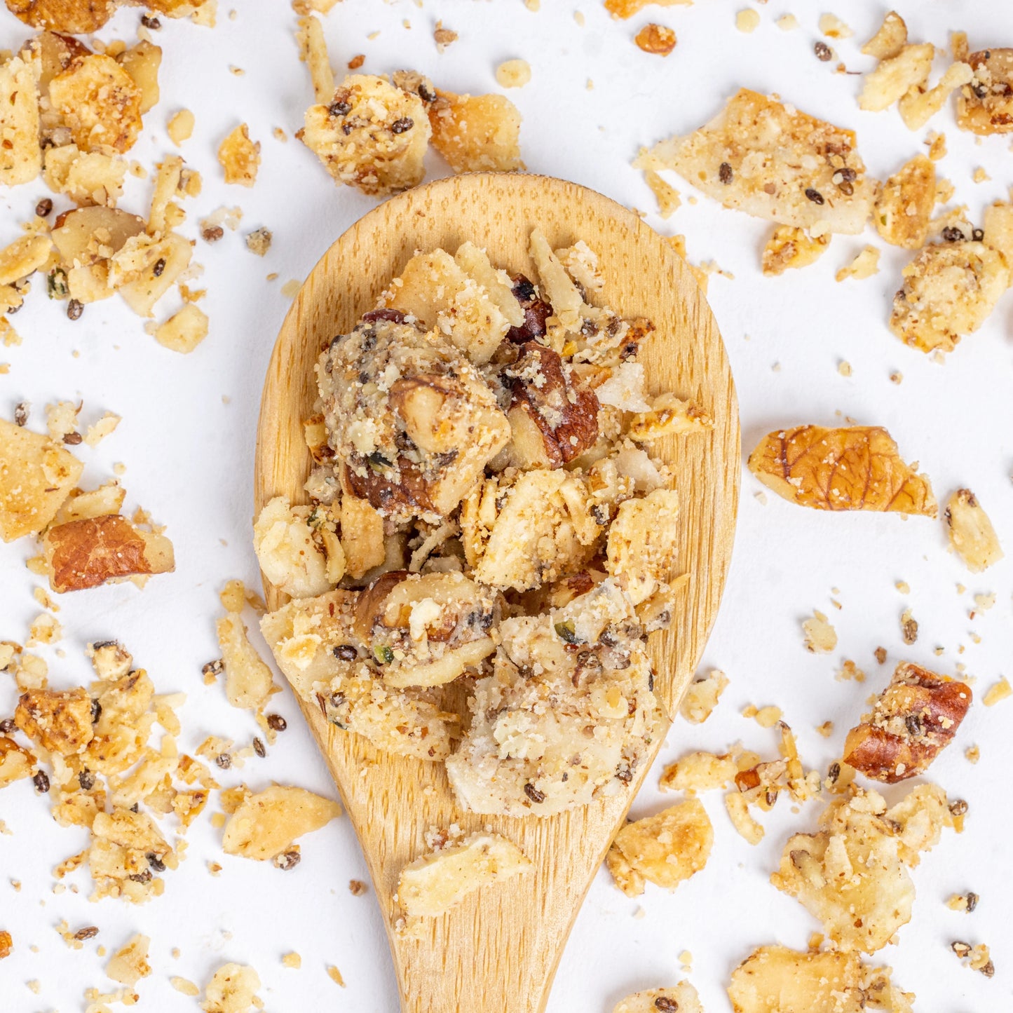 A wooden spoon of Struesli Original granola rich in prebiotic fiber.